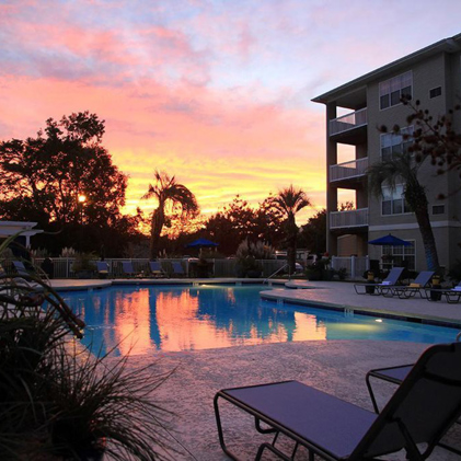Sunset view of the exterior of the apartments at Cherry Grove Commons in North Myrtle Beach, SC